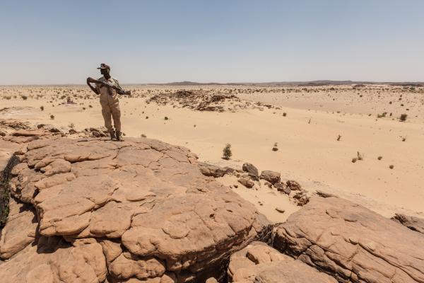 Man standing in a desert.